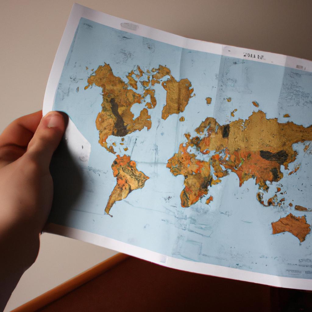 Person holding a world map
